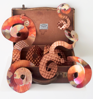 Home is where you unpack your suitcase, 2023, Re-purposed suitcase, embossed and heat-coloured copper sheet