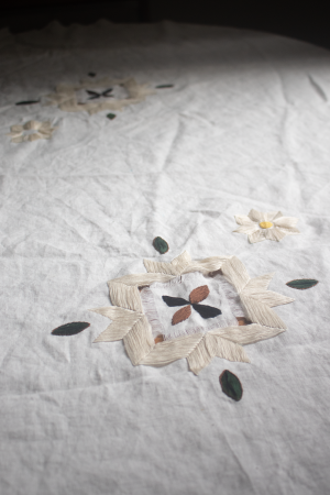 Commensal Memories, 2023, close up of tablecloth; linen, cotton thread