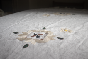 Commensal Memories, 2023, close up of tablecloth; linen, cotton thread