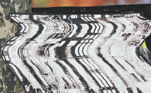 Detail of distorted print of a blown up apartment block, 2023, Screen print on acrylic spray paint.