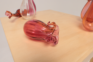 Unfolding (her misinterpretations still live beside my gut), 2024, Blown glass, timber
