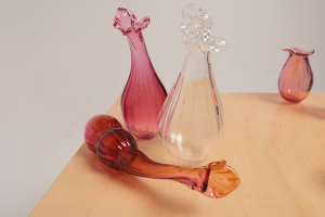 Unfolding (her misinterpretations still live beside my gut), 2024, Blown glass, timber