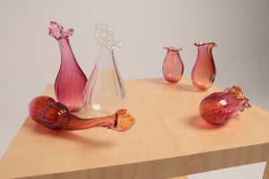 Unfolding (her misinterpretations still live beside my gut), 2024, Blown glass, timber
